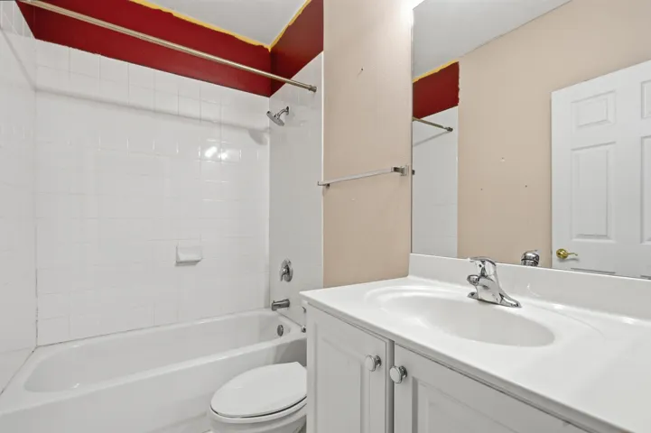 White subway tile shower surround with a built-in tub
