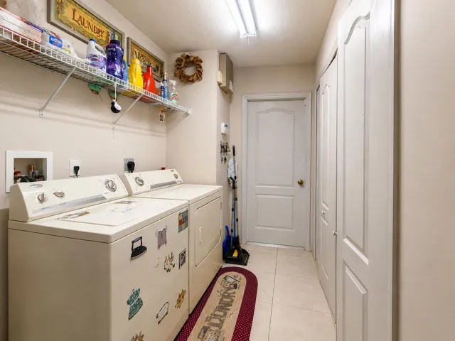 Tile flooring, wire shelving, and built-in closet storage