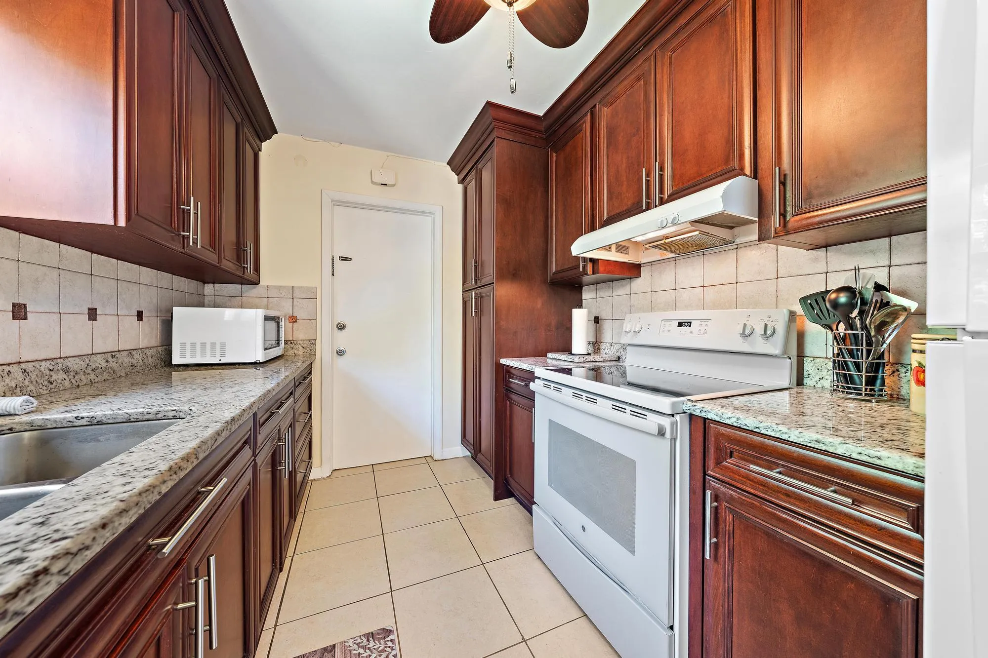 Large kitchen and Laundry room with ample space for storage