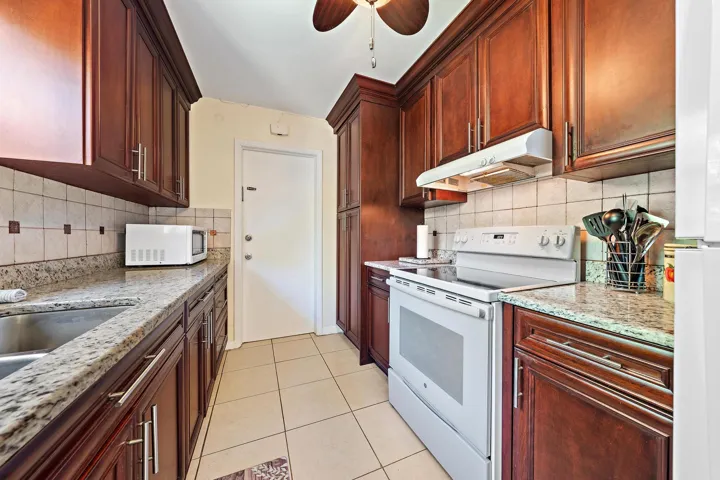 Large kitchen and Laundry room with ample space for storage
