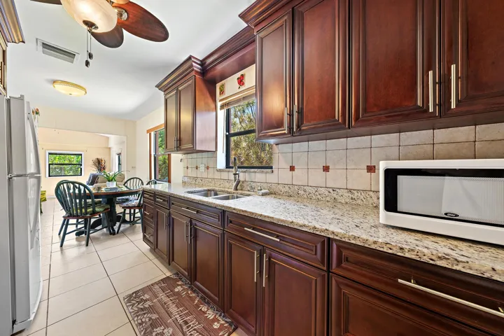 Beautiful granite counter tops and window overlooking the backyard. Ample storage space.