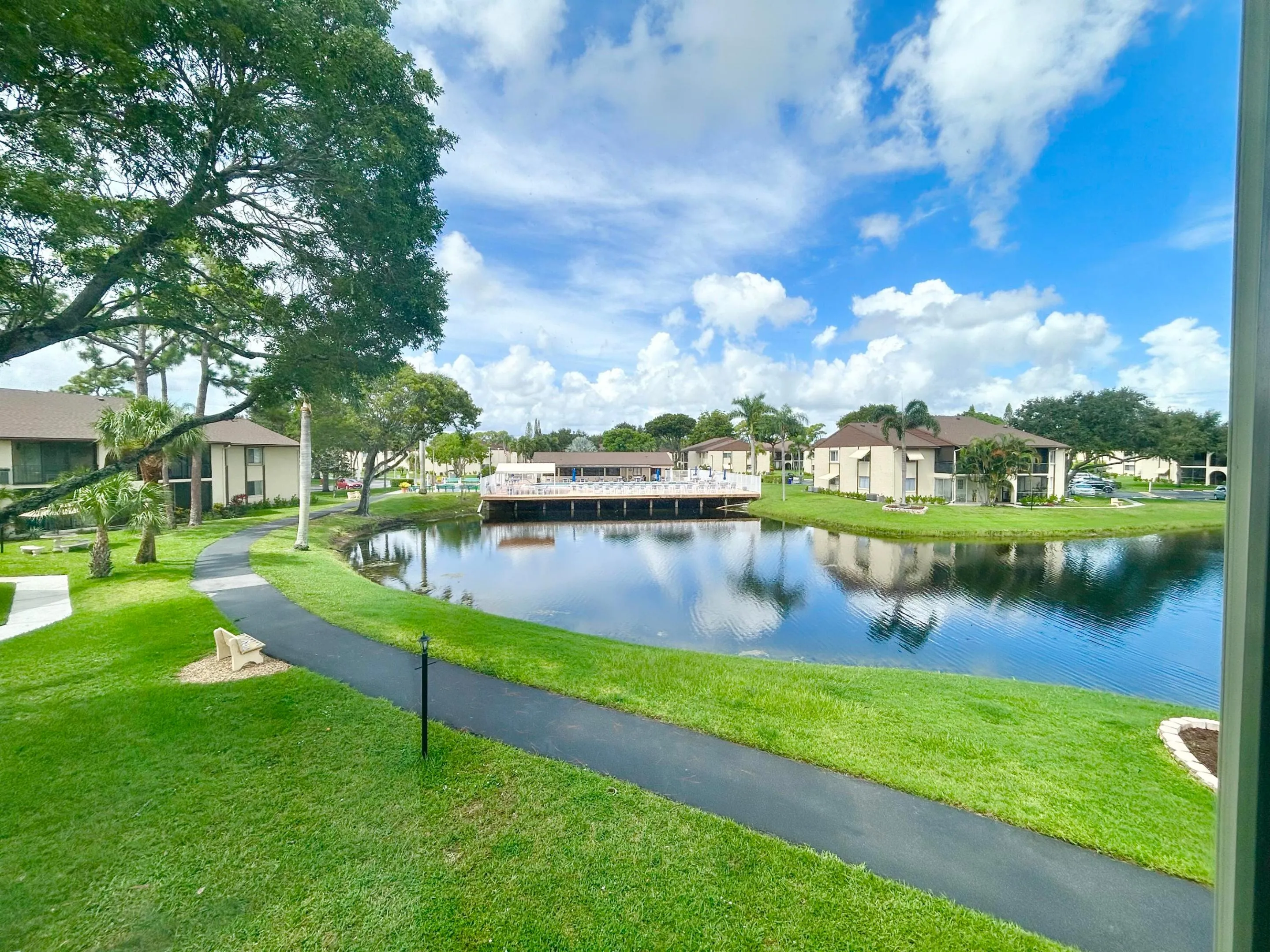 PATH LEADS TO CLUBHOUSE AND POOL