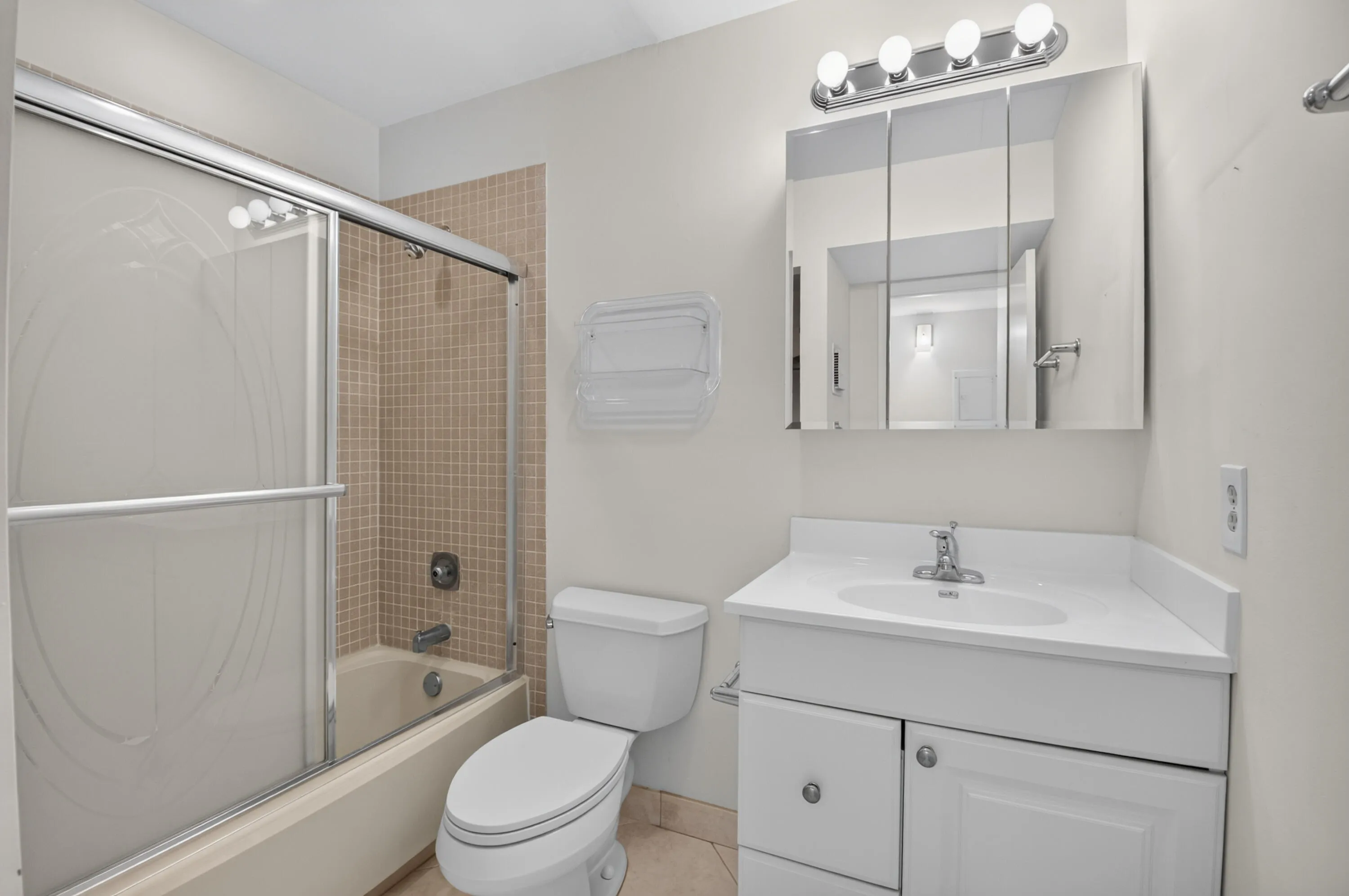 Guest Boasts a Bathtub and Glass Enclosed Doors