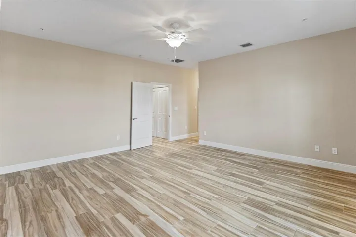 Remarkable size primary suite with 2 walk-in closets, private commode, his and her sinks