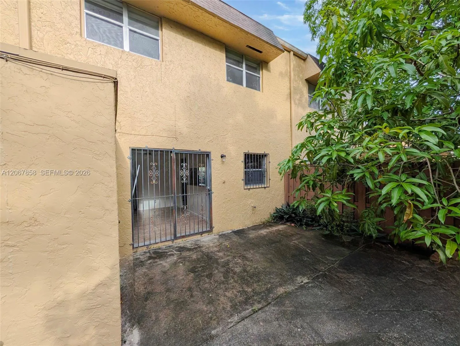 Fenced yard with storage shed