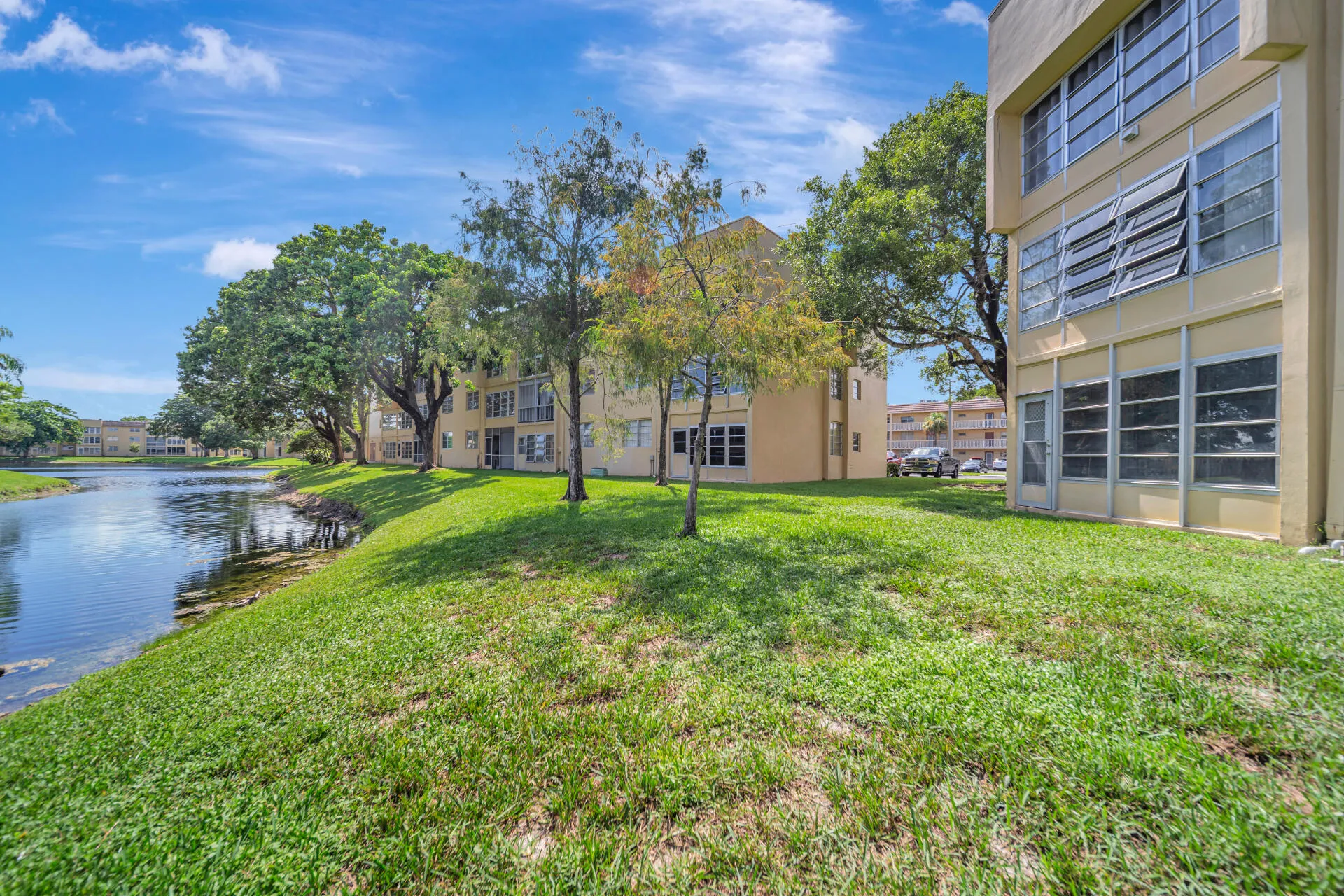 Water & grassy area with entrance directly from the Sun Room
