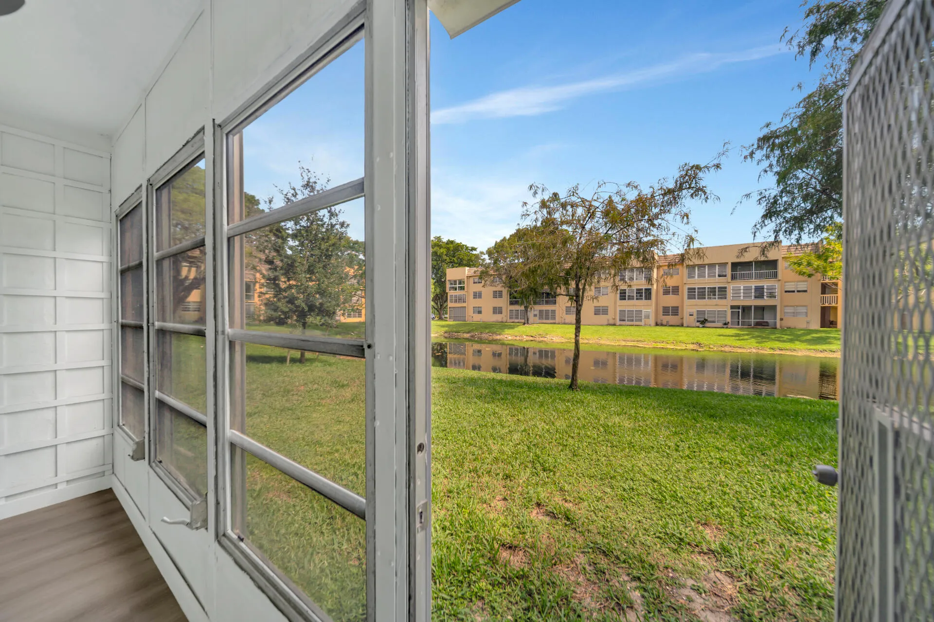 Inviting Enclosed Sun Room with Waterview