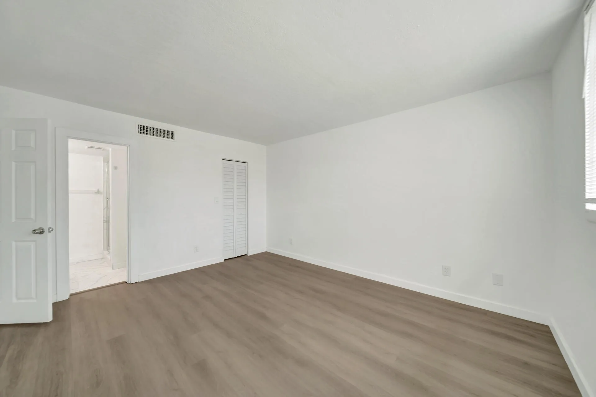 Spacious Primary Bedroom with convenient walk-in closet
