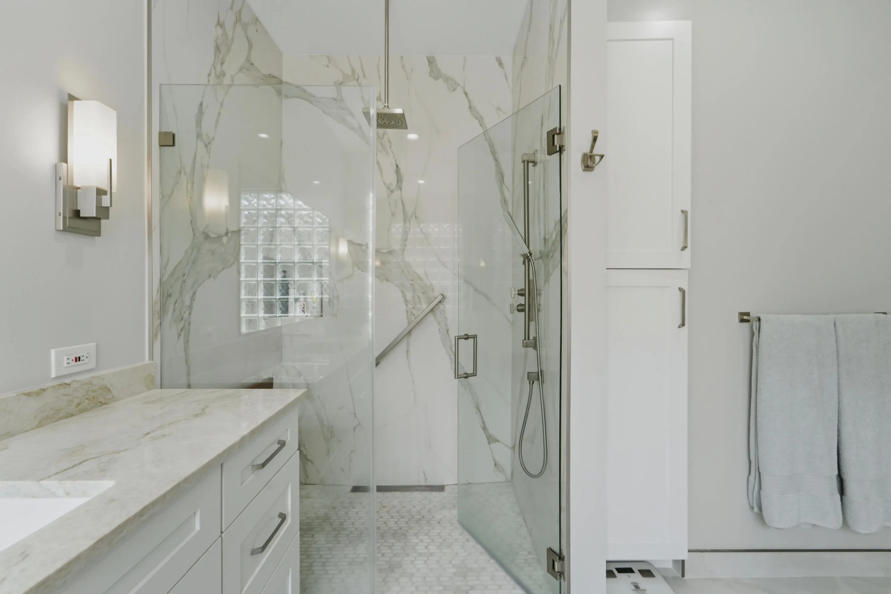 Dual vanities, extensive cabinetry and a spacious layout provide comfort and storage in the primary bath.