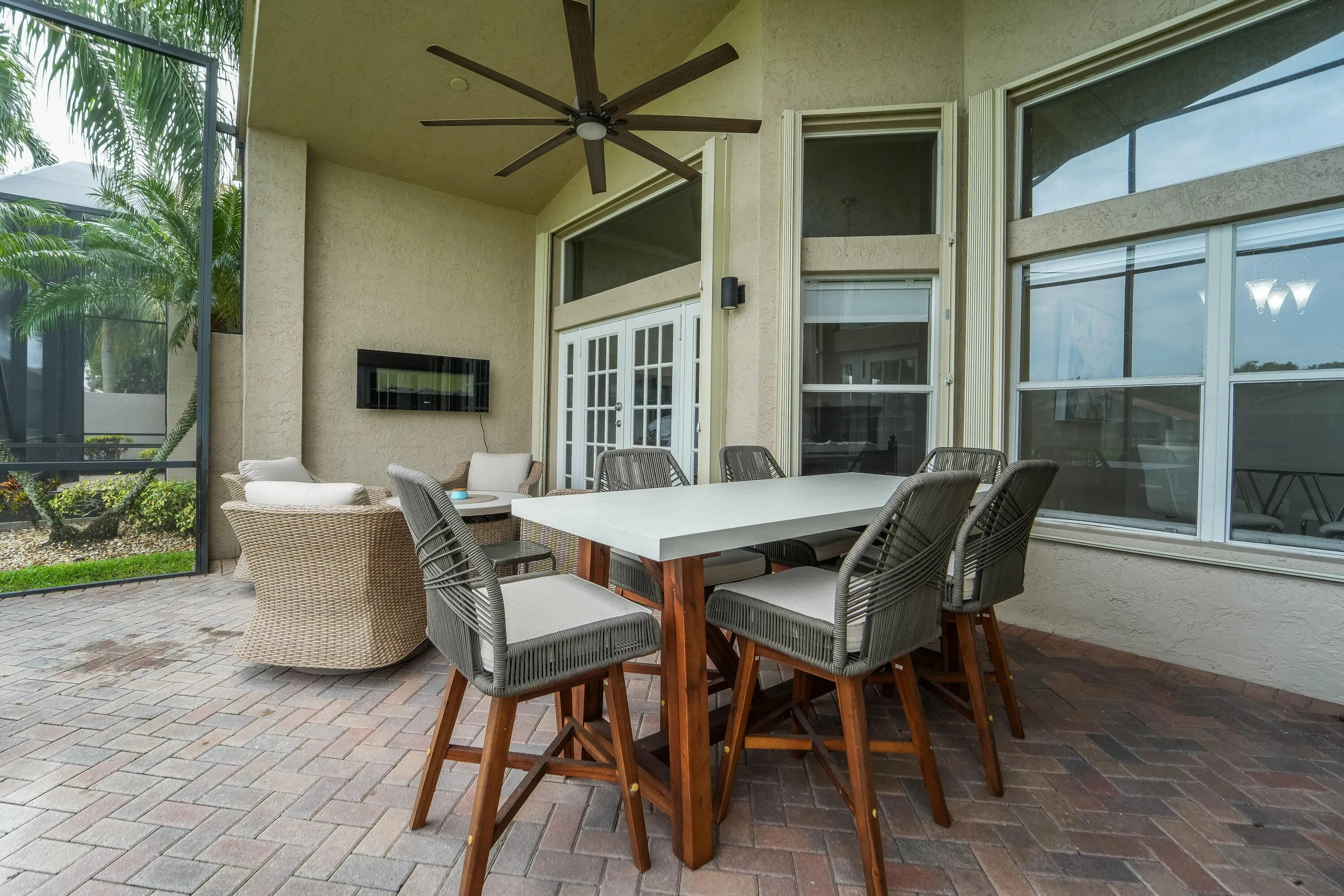 Screened outdoor living area offers a peaceful place to relax, dine and enjoy the beautiful lake setting.