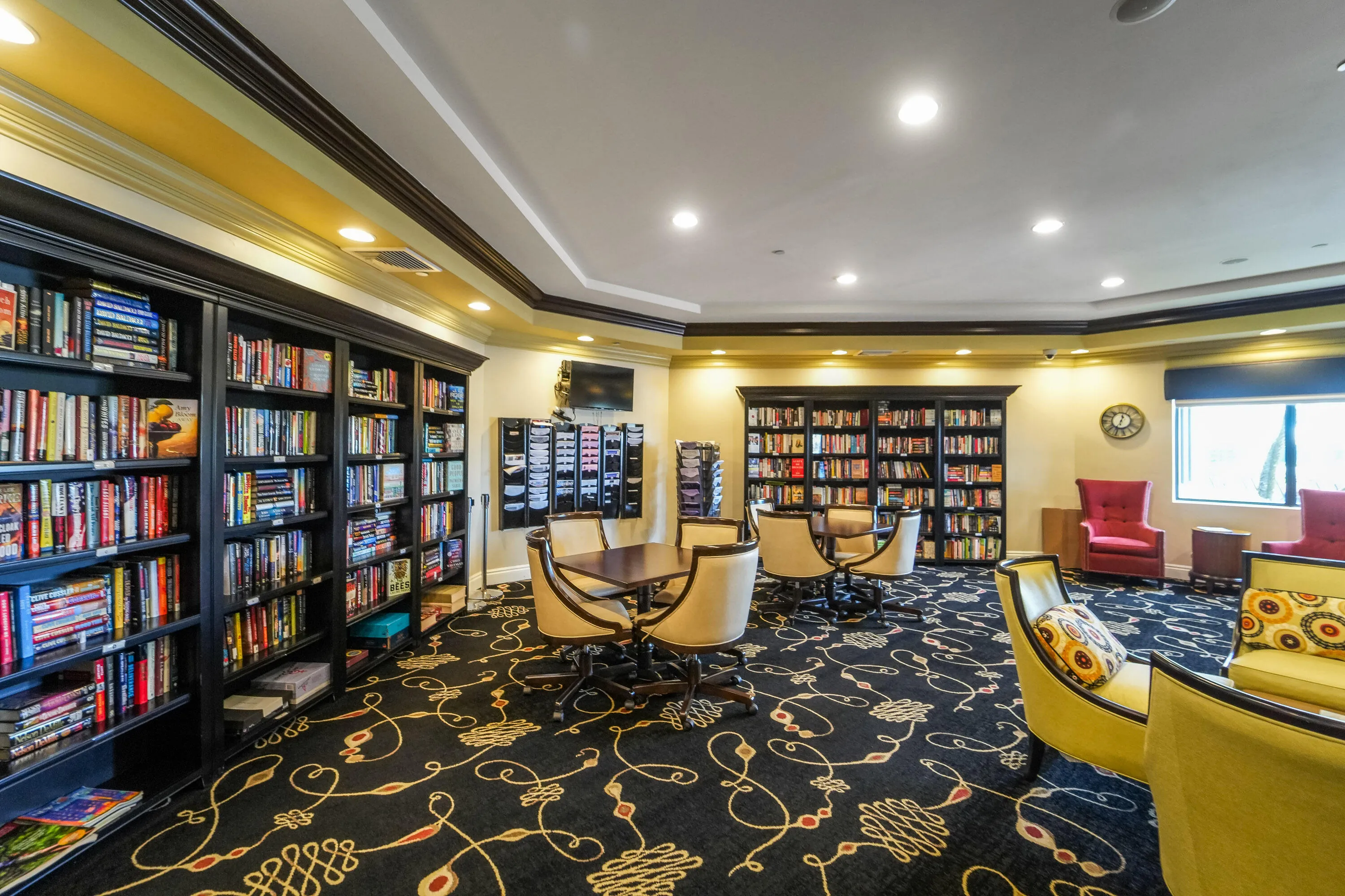 Community and media room includes a library and comfortable space for reading, gathering and staying connected.