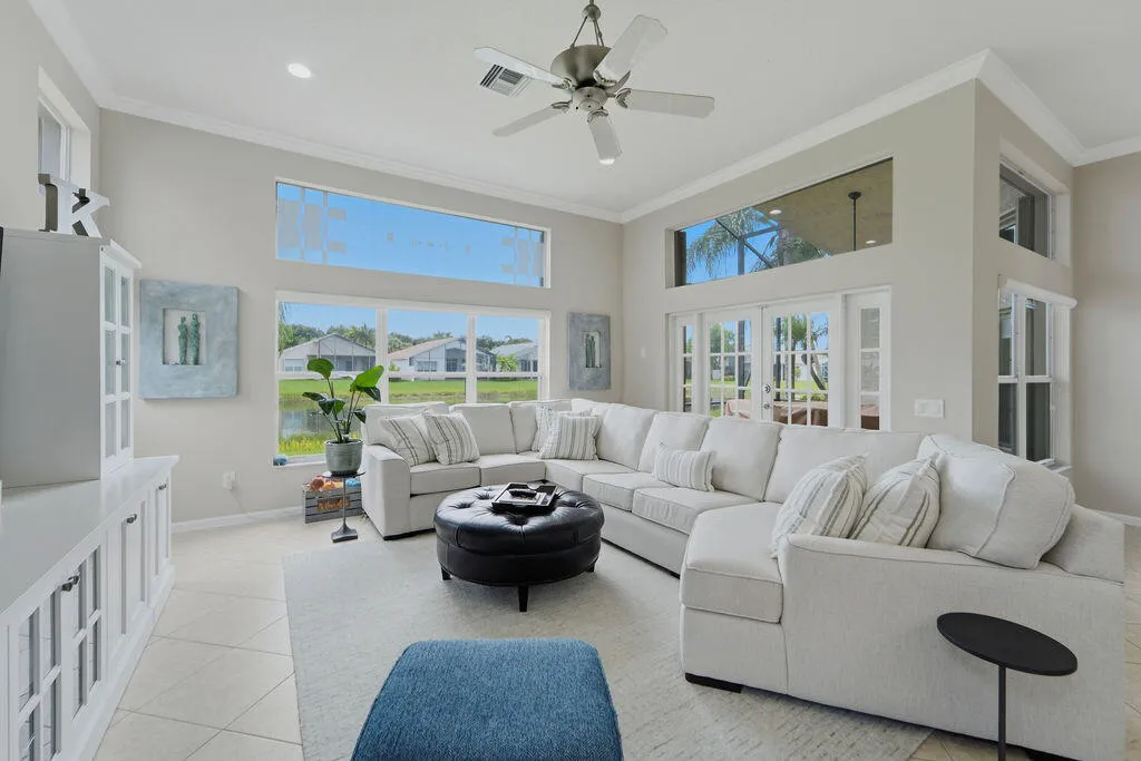 Open family room enjoys large windows, built-in cabinetry and an easy connection to the kitchen and lanai.