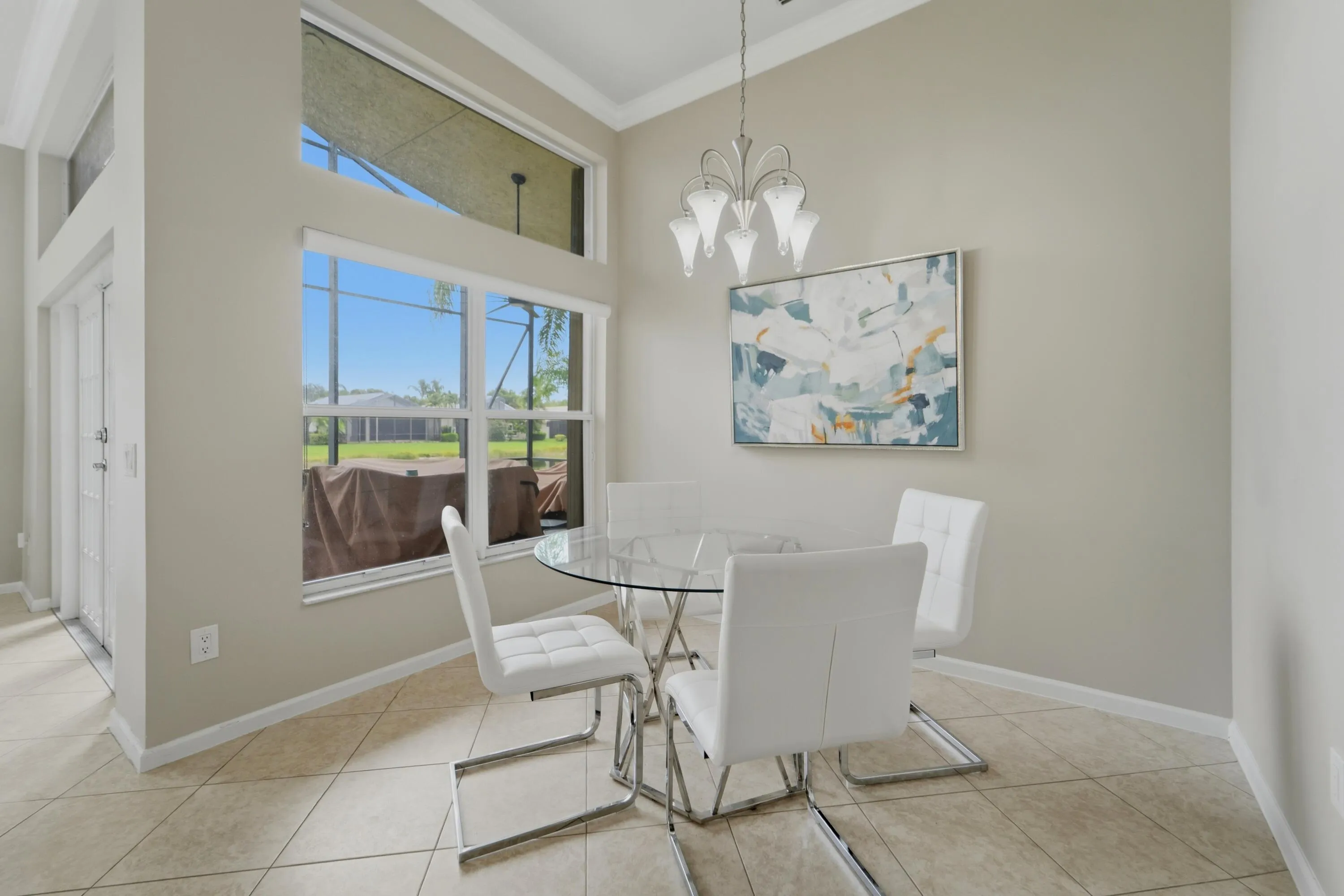 Bright casual cafe area is conveniently positioned beside the kitchen and filled with natural light.