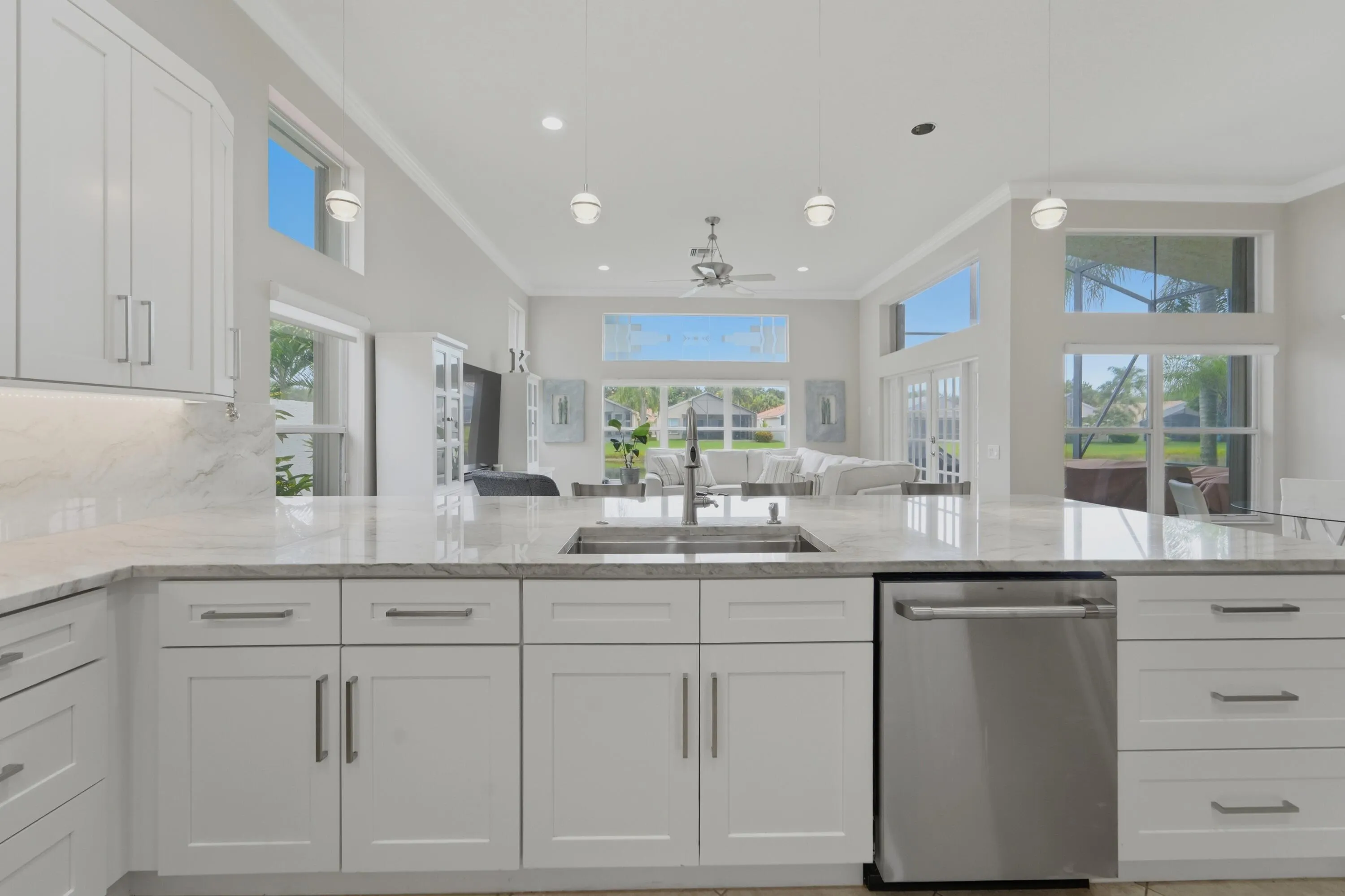 Oversized peninsula with sink provides abundant workspace, storage and a natural gathering place at the heart of the home.
