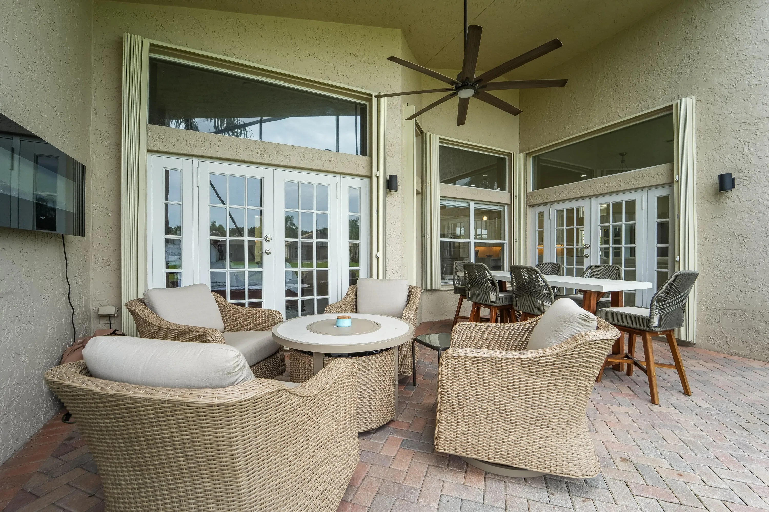 Covered seating area expands the home's living space outdoors and connects easily to the interior.
