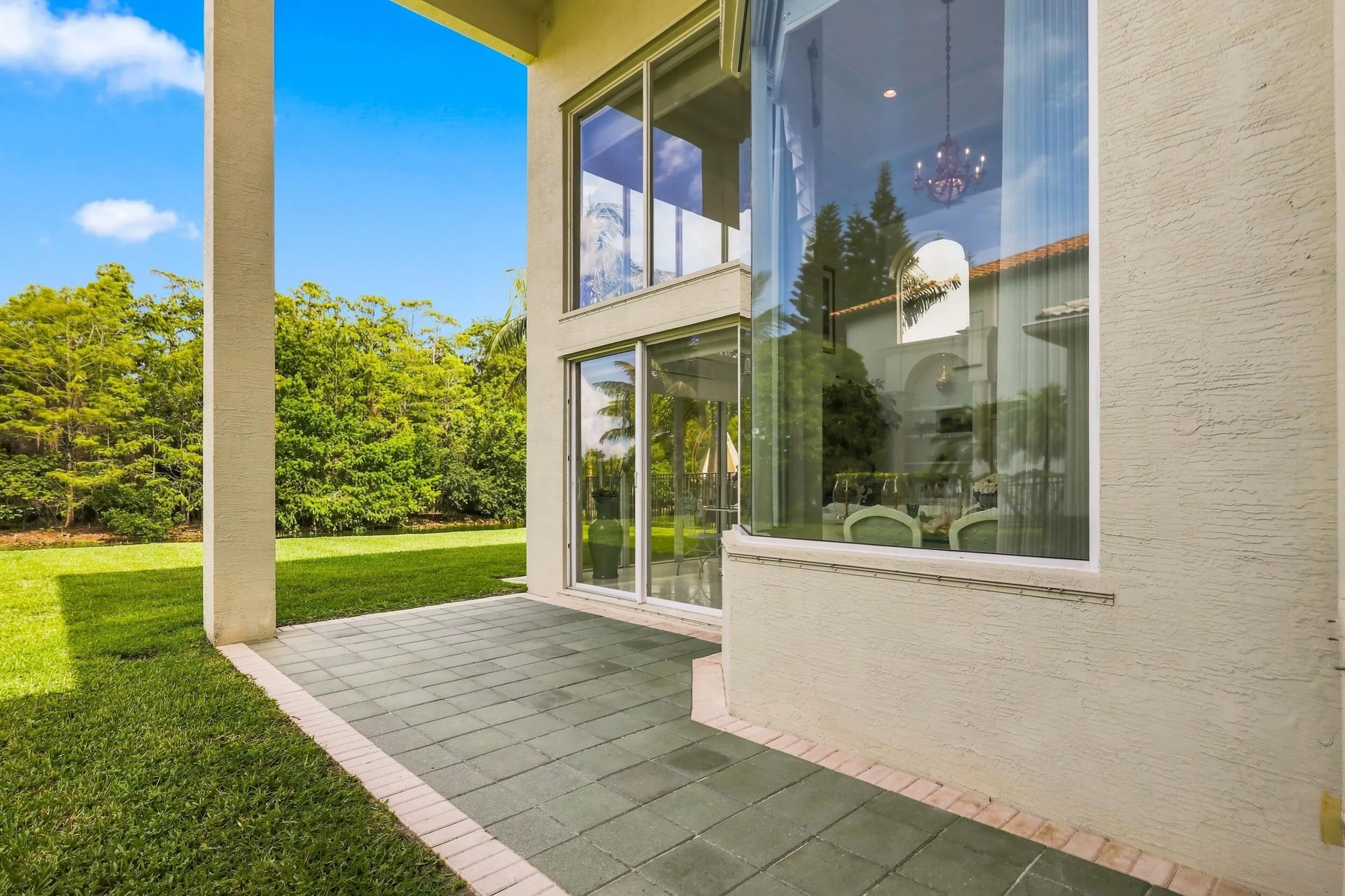 Wrap around paved back patio area
