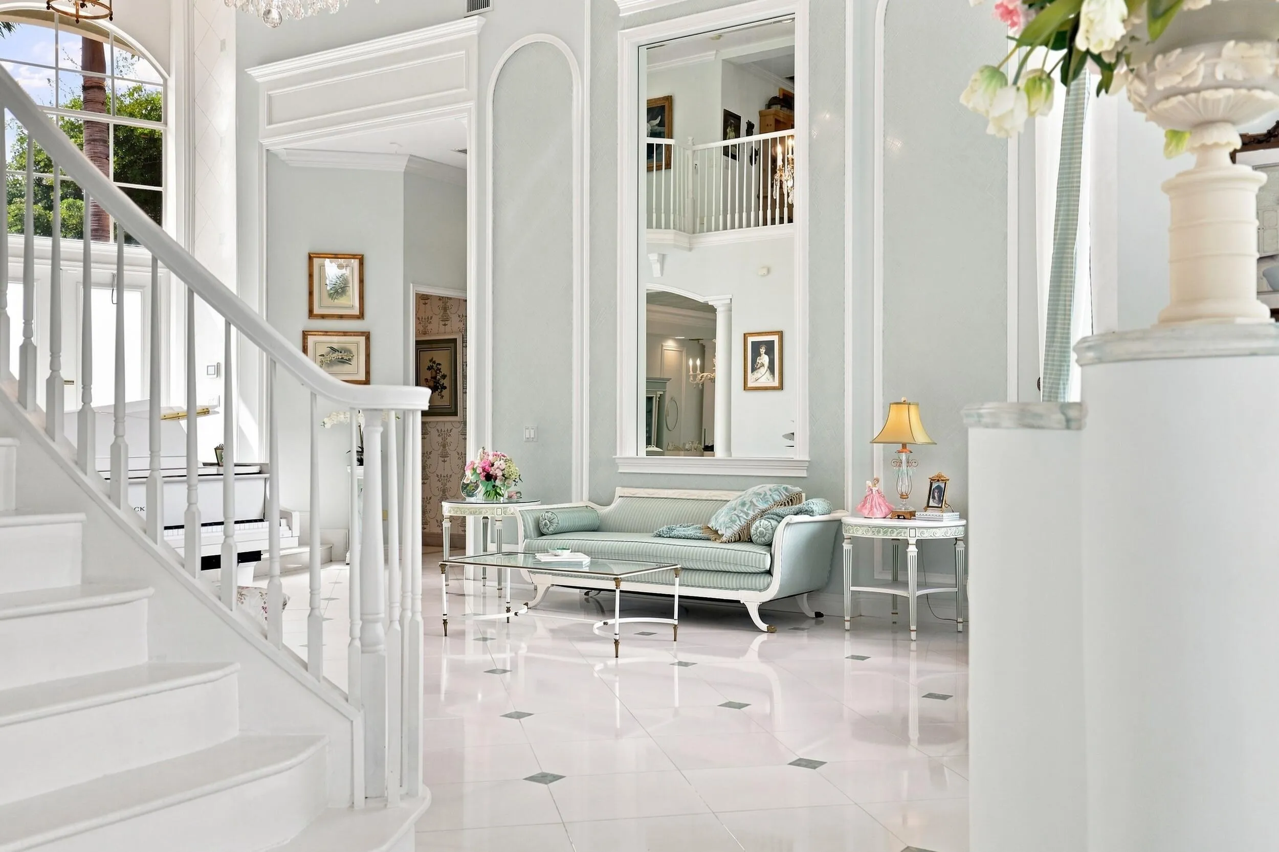 Grand staircase to 3 bedrooms, 3 en suite bathrooms and large loft on 2nd floor