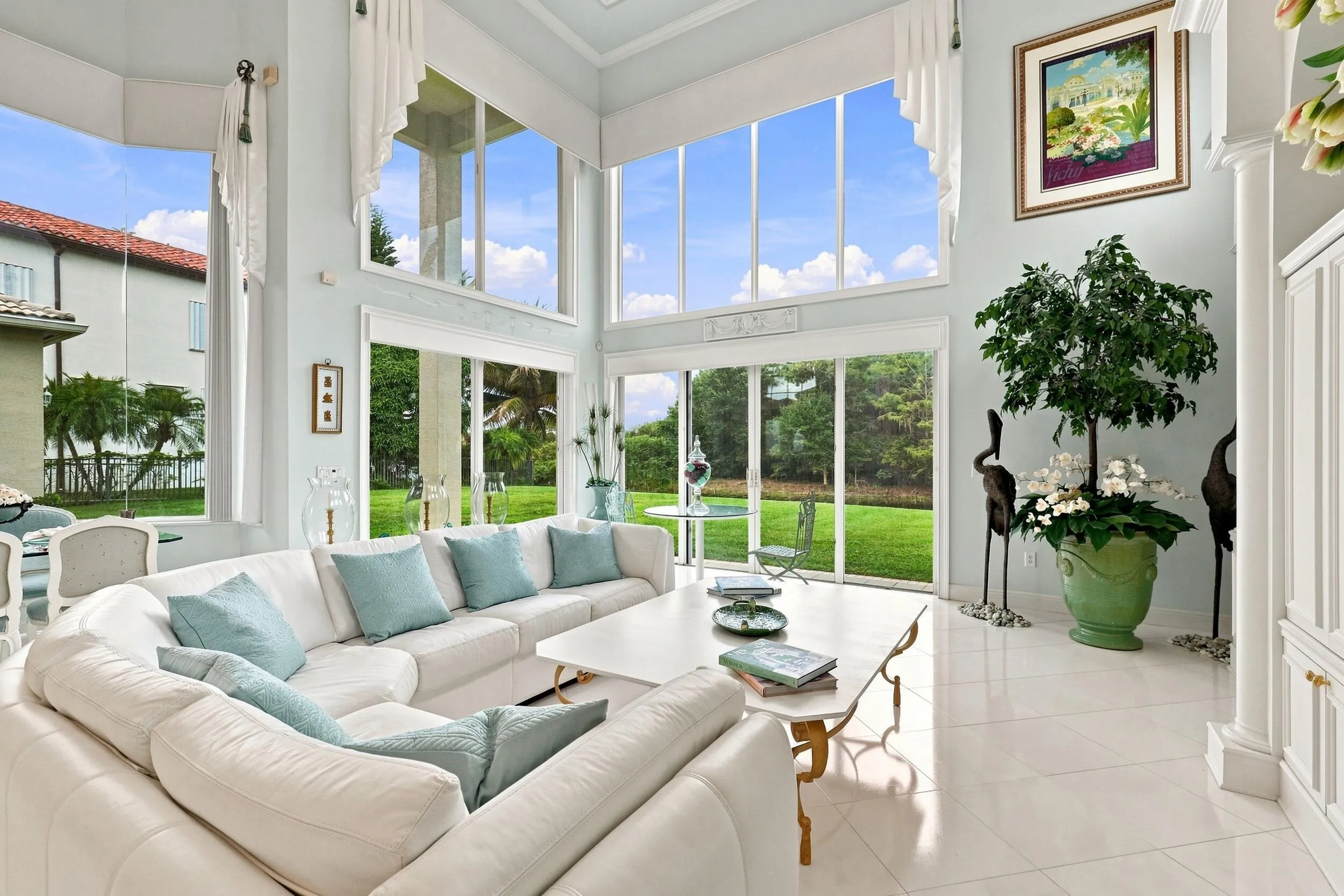 Impressive natural light shining trhough massive windows and transoms