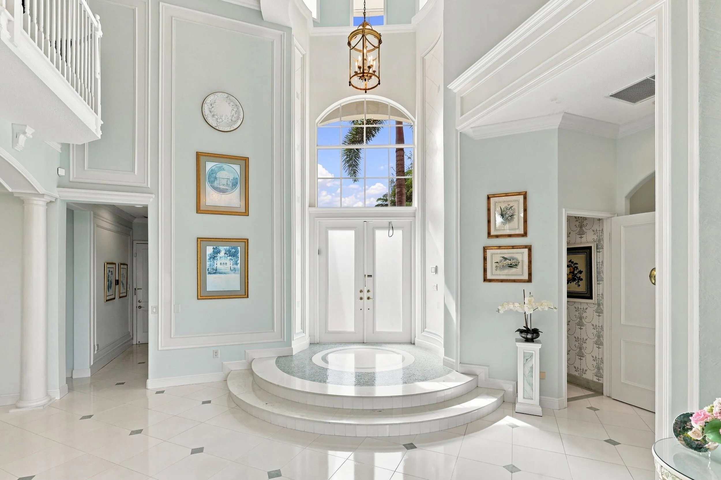 Grand foyer to open floor plan. Natural light shining through.