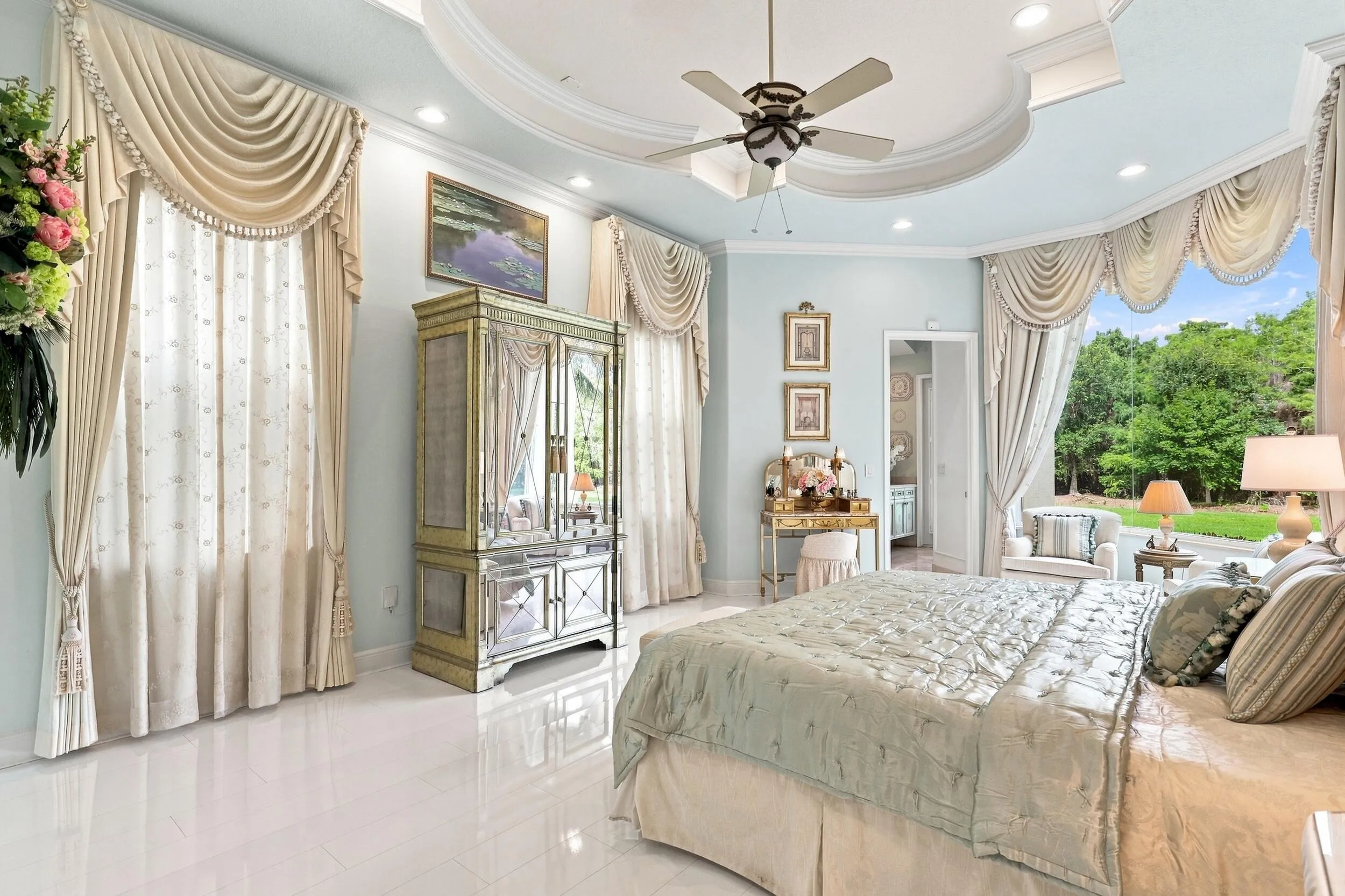 Large primary bedroom on 1st floor with sitting area with large picture window