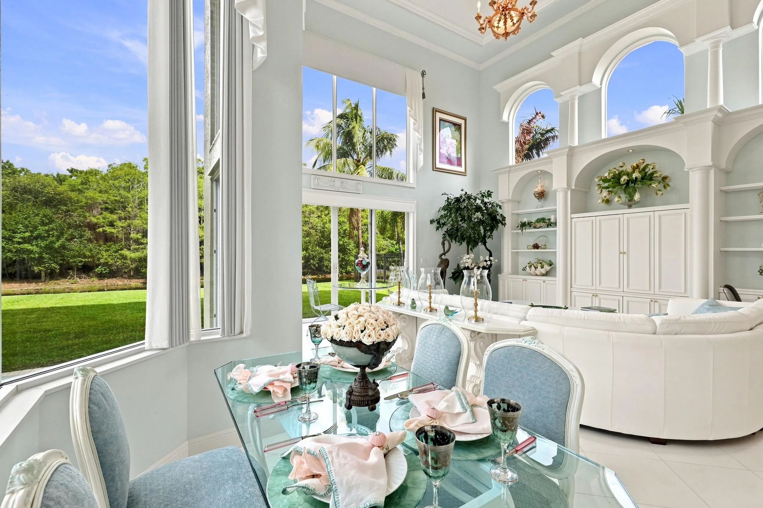 Informal dining room opens to large family room with impressive transom windows throughout
