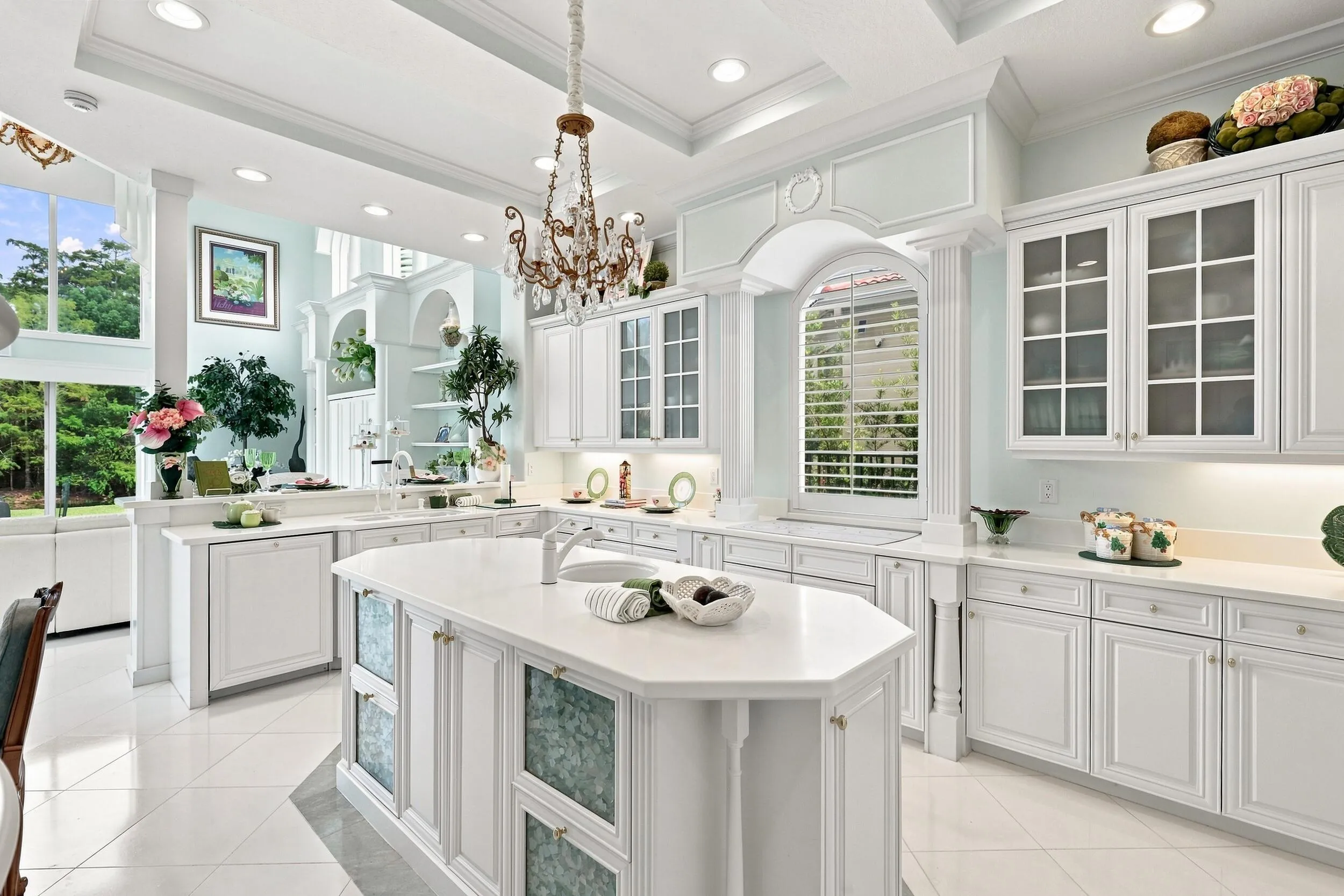 Chef's kitchen with large island with 2nd sink and storage underneath