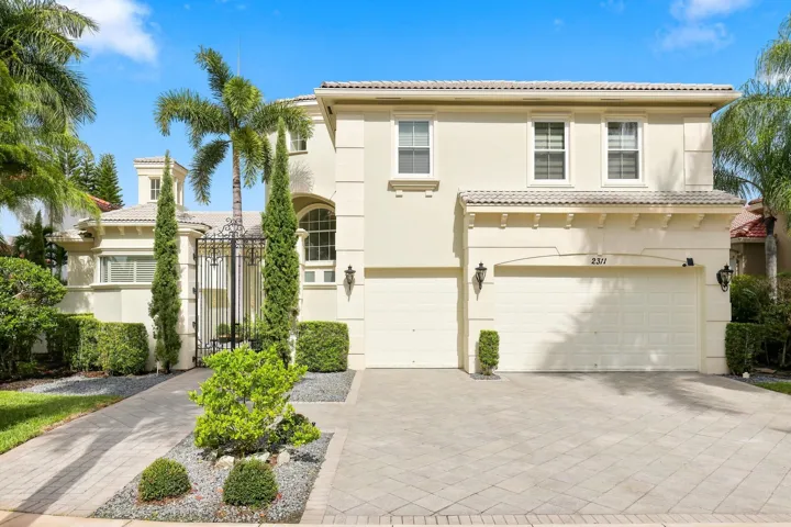 Elegant Palm Beach designed estate home in Stotesbury Village in Olympia, Wellington FL. 4,830 sq ft with 5 Bedrooms & 6 1/2 bathrooms on large premium lake and nature preserve lot.