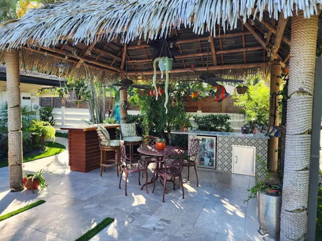 Tiki re-thatched with durable artificial thatch.
