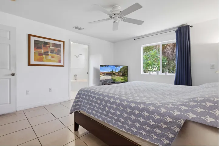 Master Bedroom with Window View to the Back yard Garden