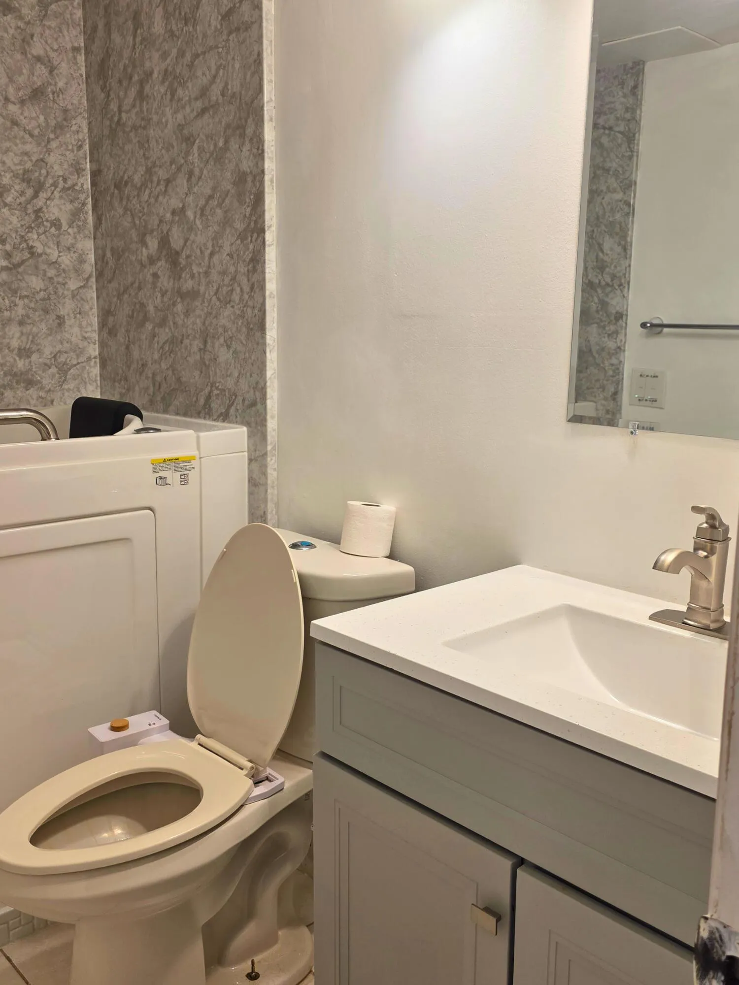 Vanity with integrated sink, contemporary faucet, and lower cabinetry