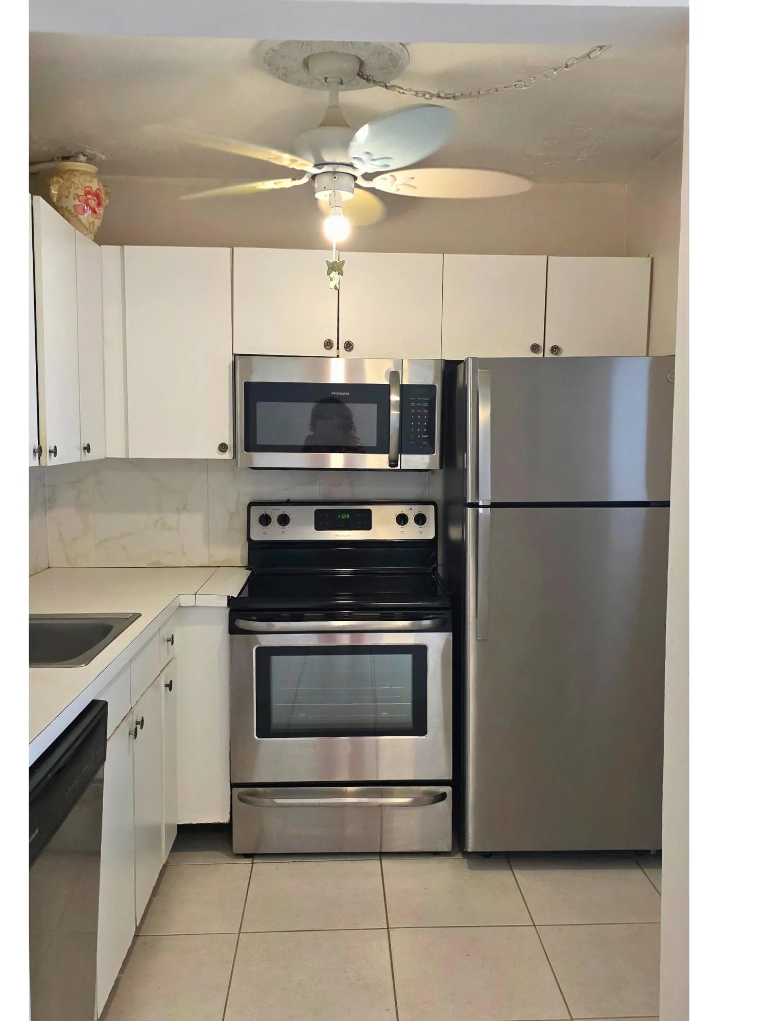 White cabinetry with coordinating countertops