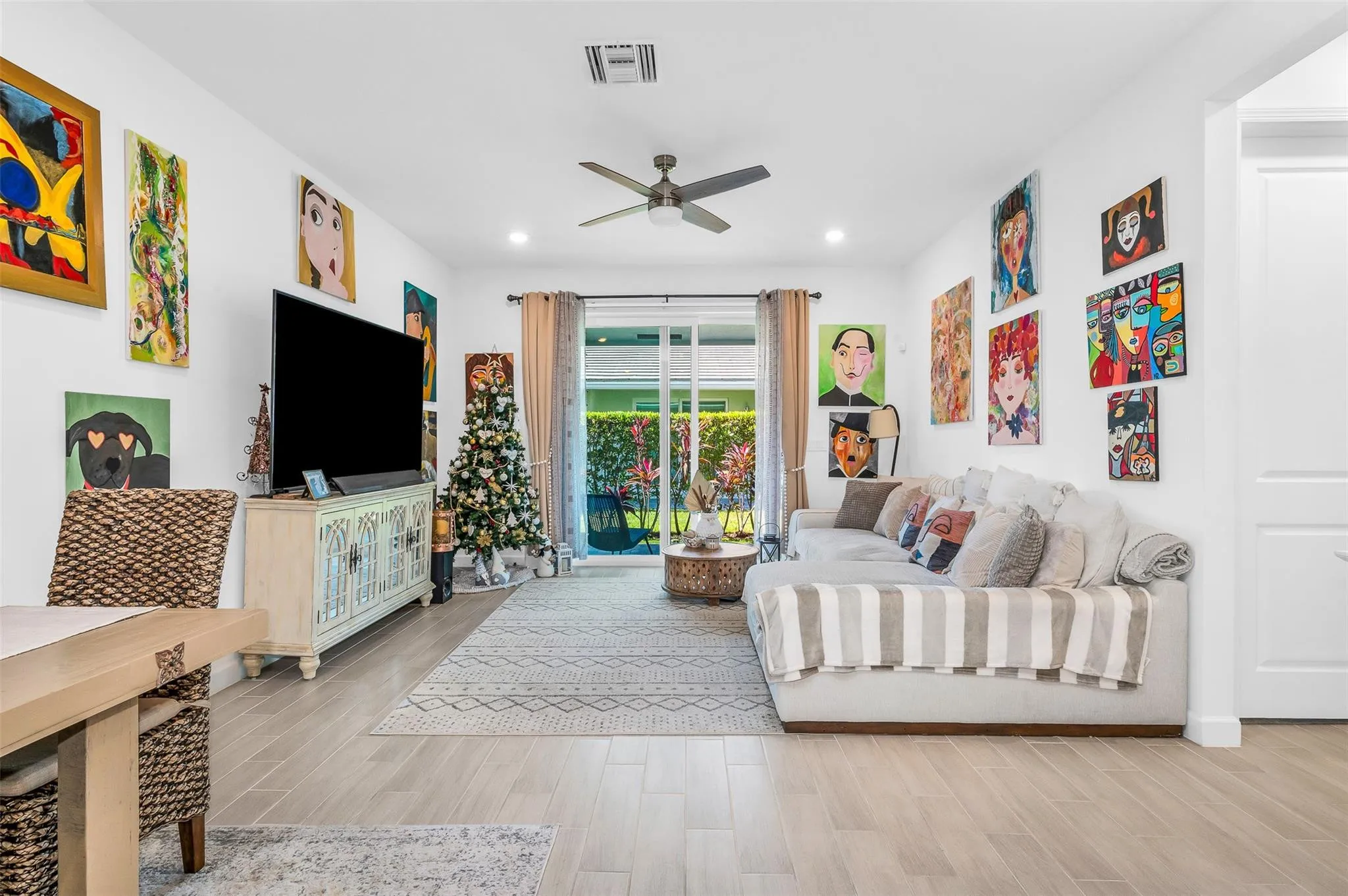 Recessed lighting, tile flooring, ceiling fan, and sliding glass door leading to outdoor space