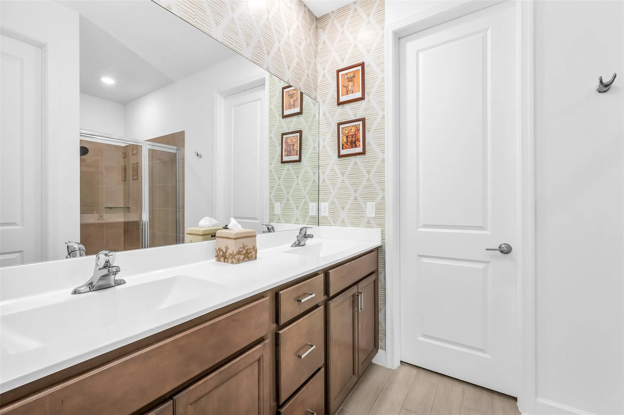 Dual vanity with integrated sinks, wood-finish cabinetry