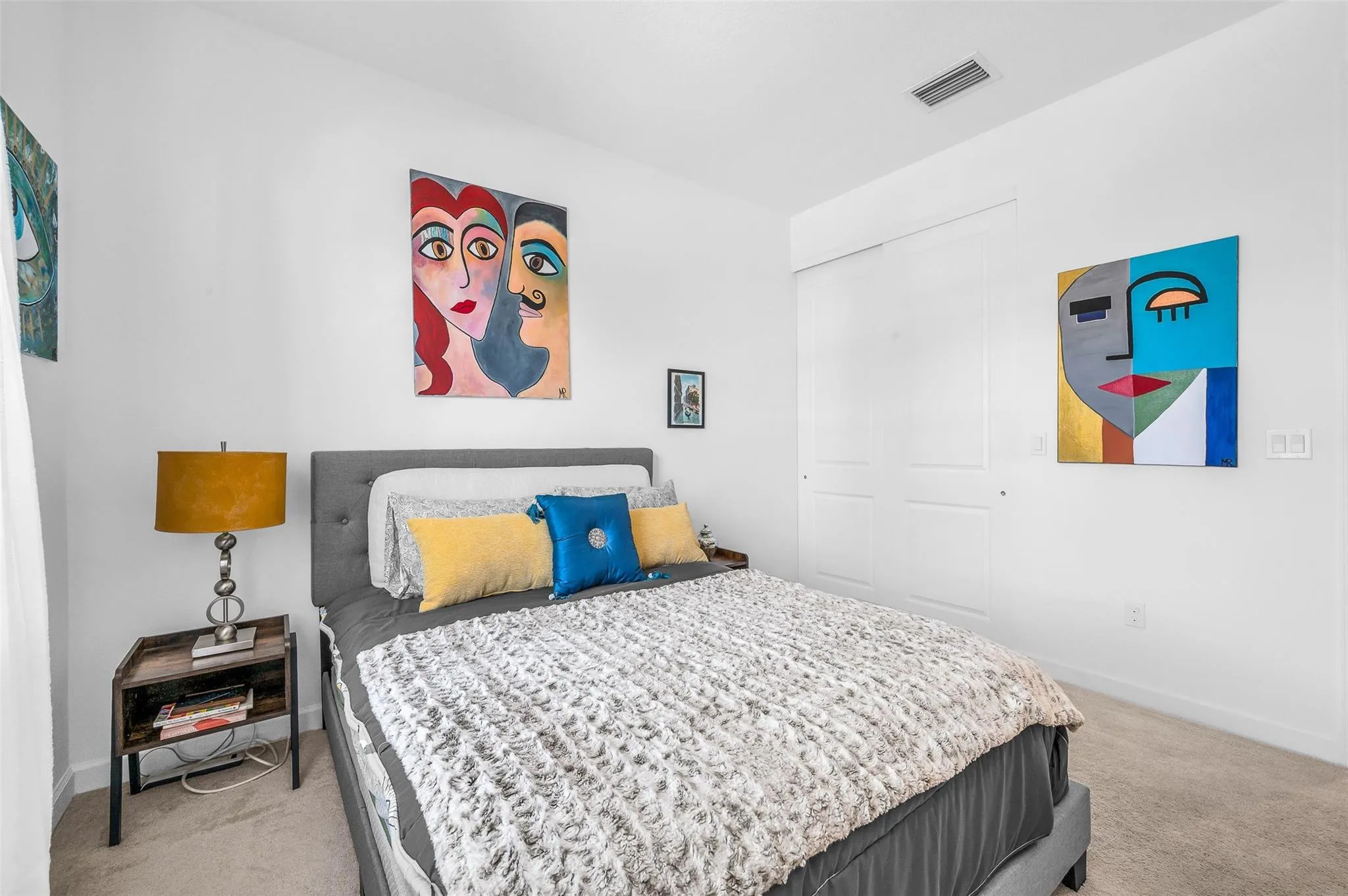 Carpeted bedroom and white wall finishes