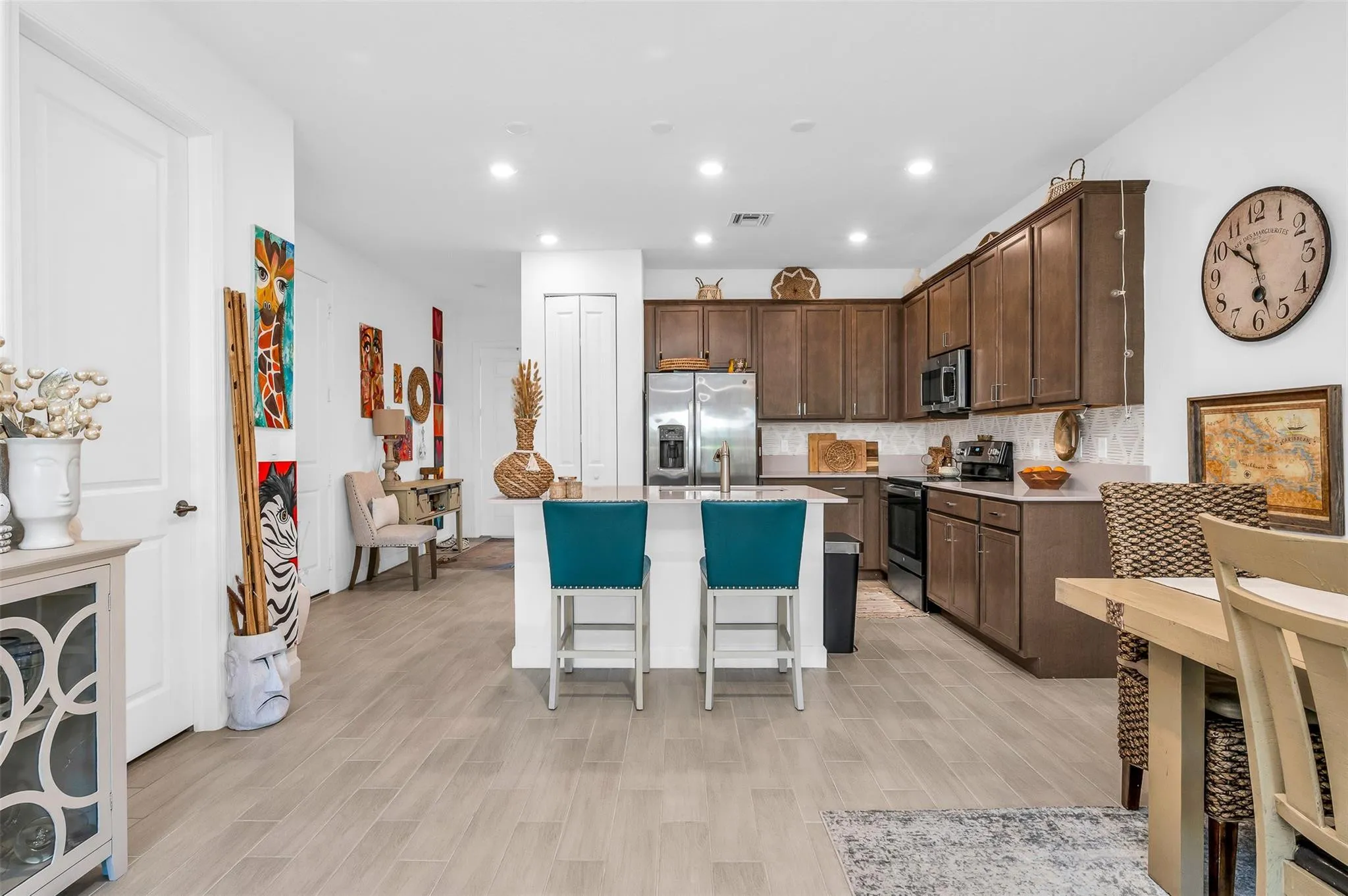 Kitchen featuring tile flooring, recessed lighting, and rich wood cabinetry