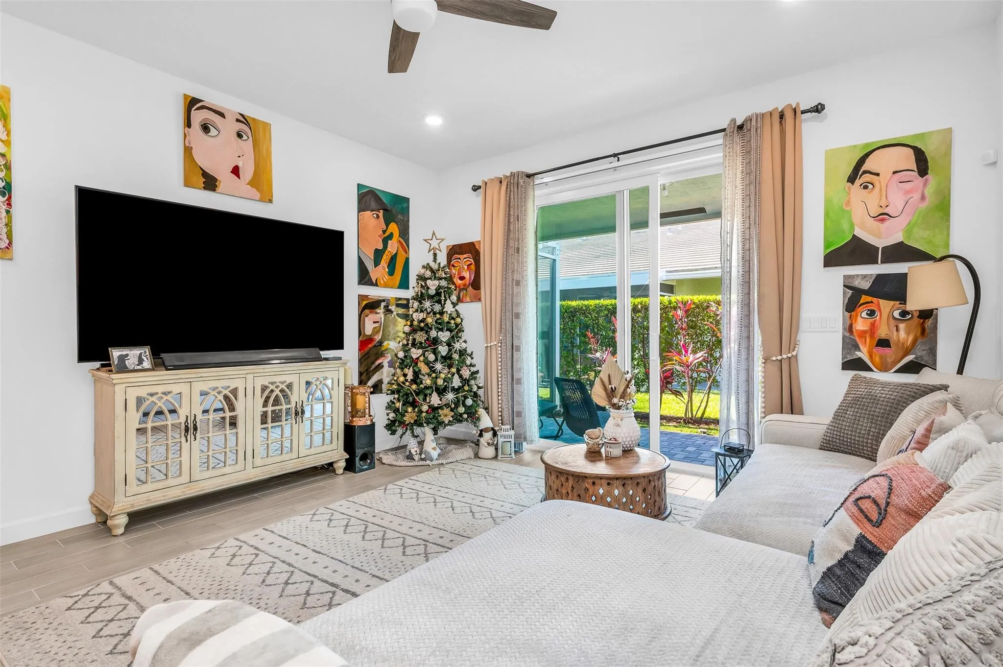 Recessed lighting, ceiling fan, tile flooring, sliding glass doors, and direct patio access