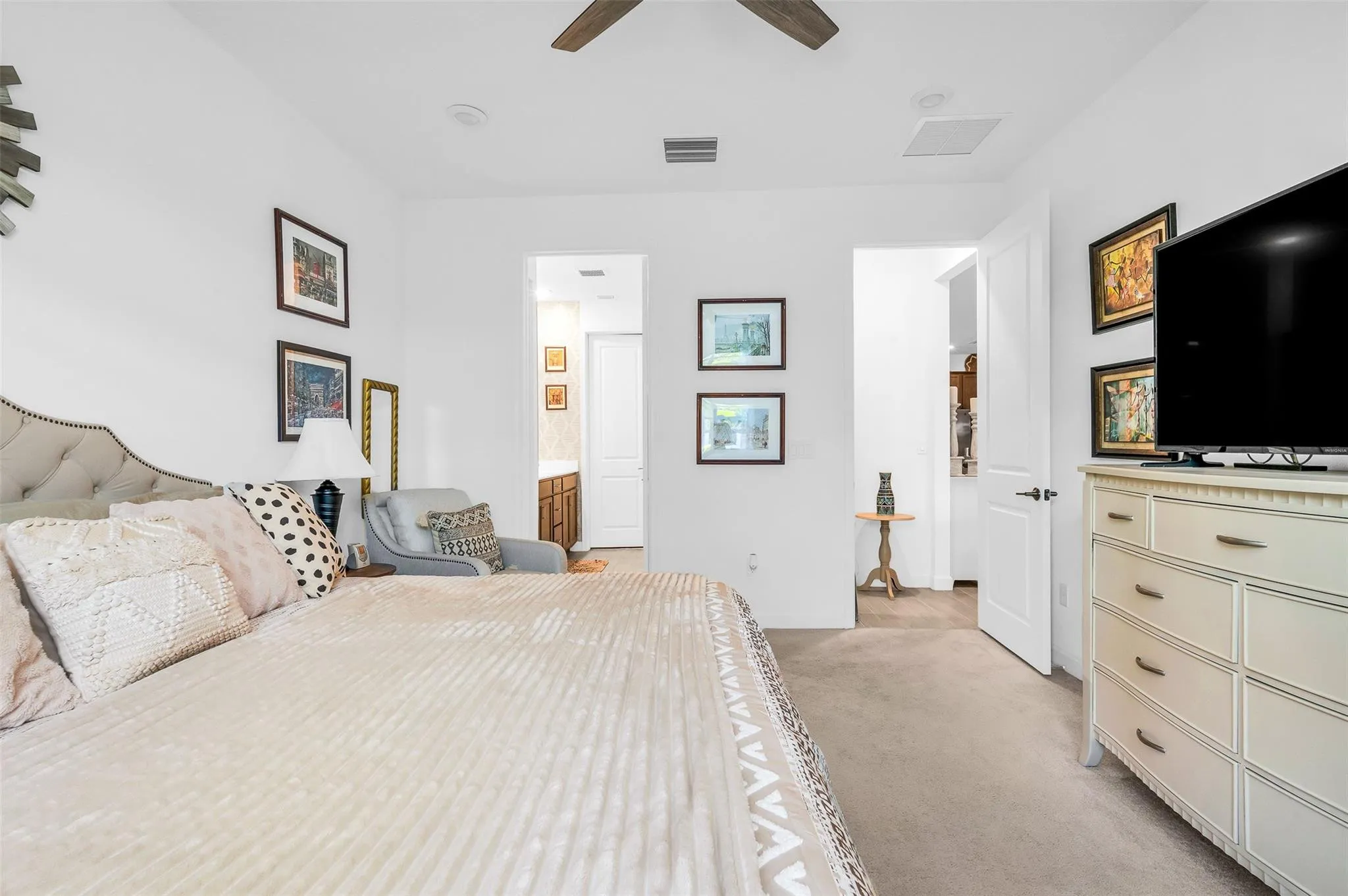 Carpeted flooring paired with neutral wall paint