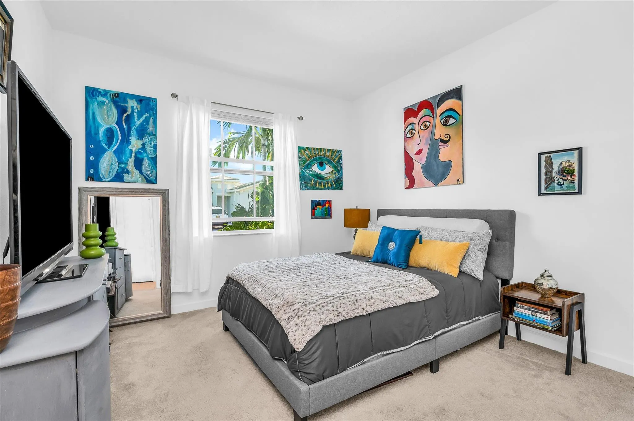 Carpeted bedroom and white wall finishes