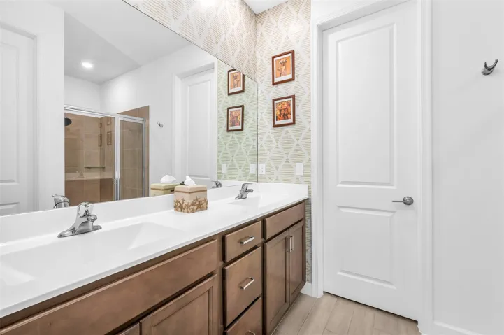 Dual vanity with integrated sinks, wood-finish cabinetry