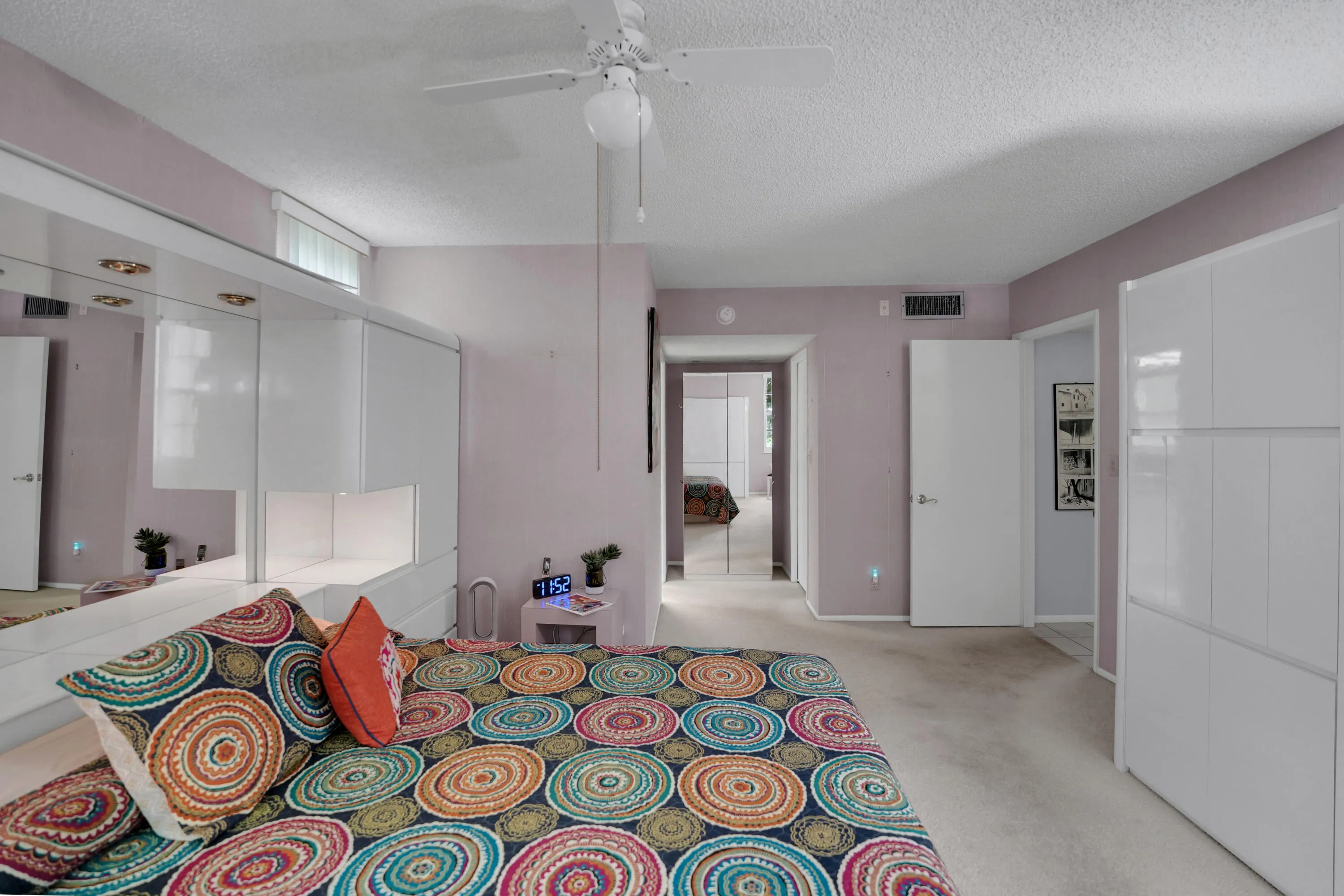 Large primary bedroom with 2 closets one is walk in