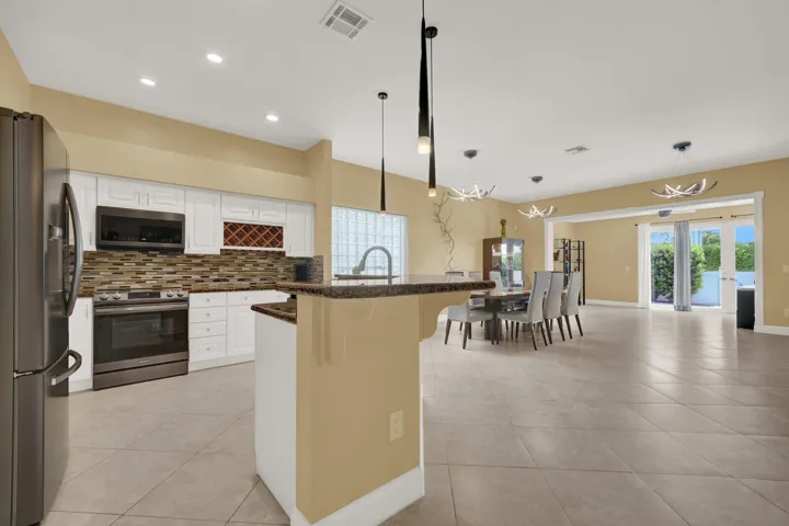KITCHEN OVERSEEING SECOND LIVING ROOM / DINING AREA