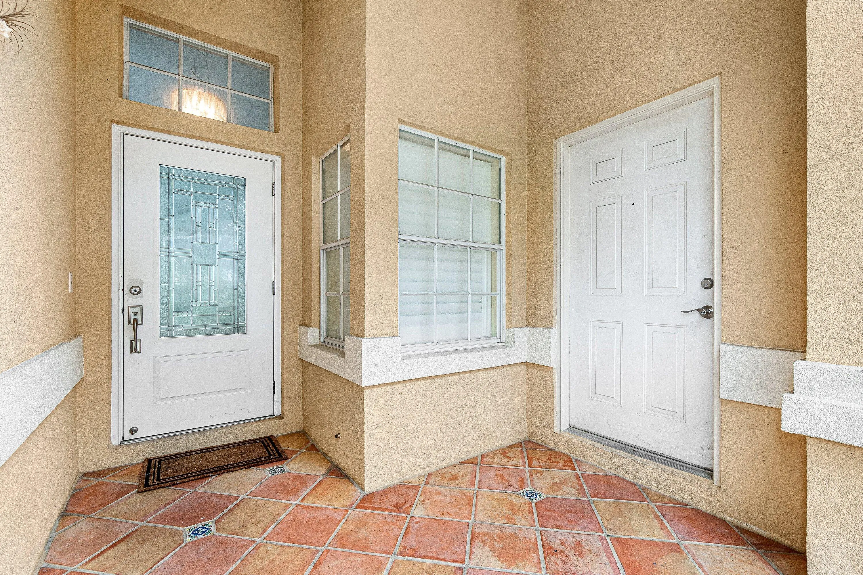 covered entrance, screened in with garage access