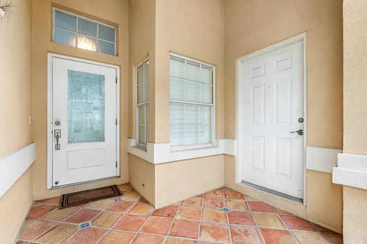 covered entrance, screened in with garage access