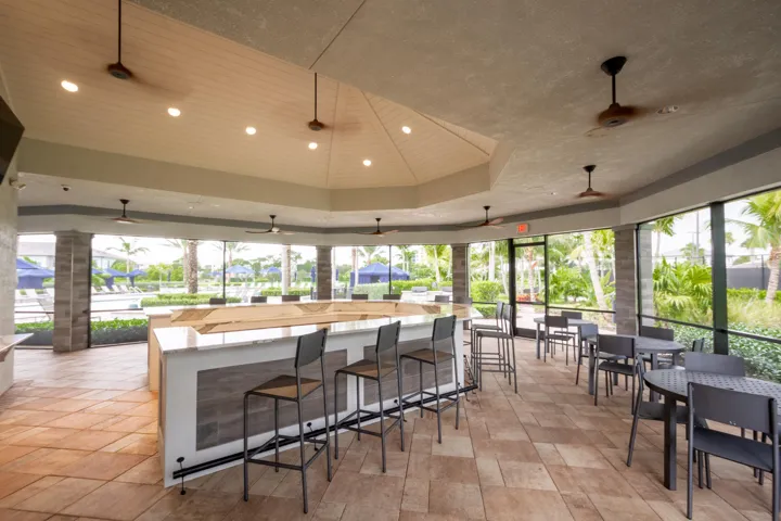 Large Outdoor bar by the pool with community grills
