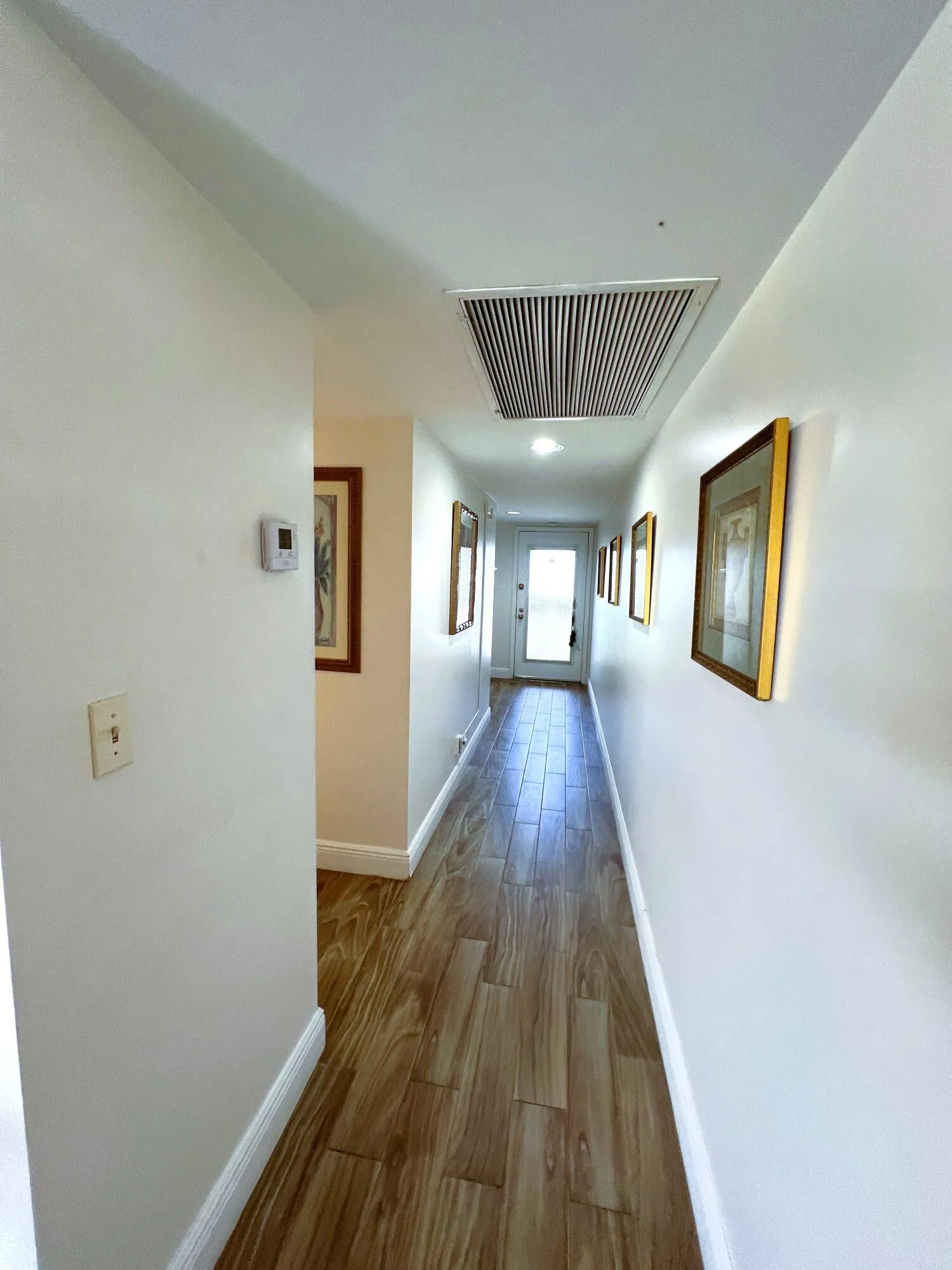 Hallway to Half Bath and Bedroom