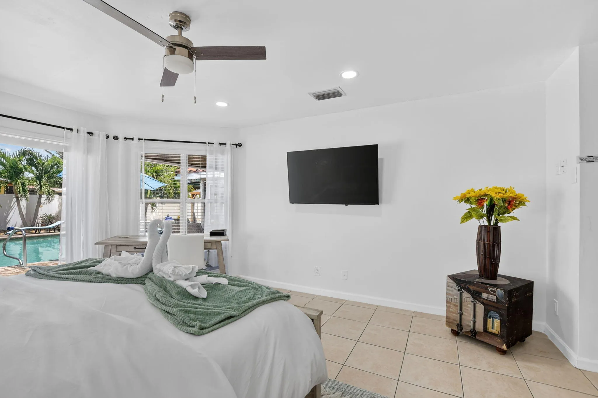 Tiled flooring and recessed lighting illuminate this space