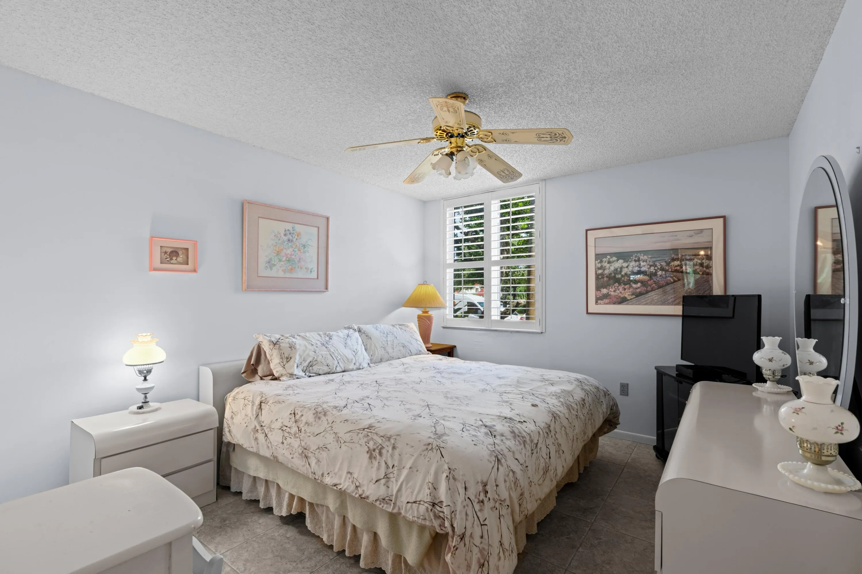 Guest Bedroom with Plantation Shutters and walk in closet.