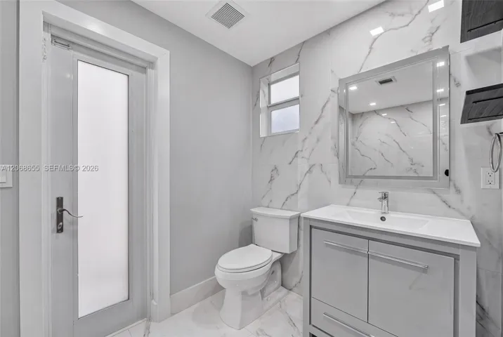 Interior and Exterior access to Guest Half Bathroom