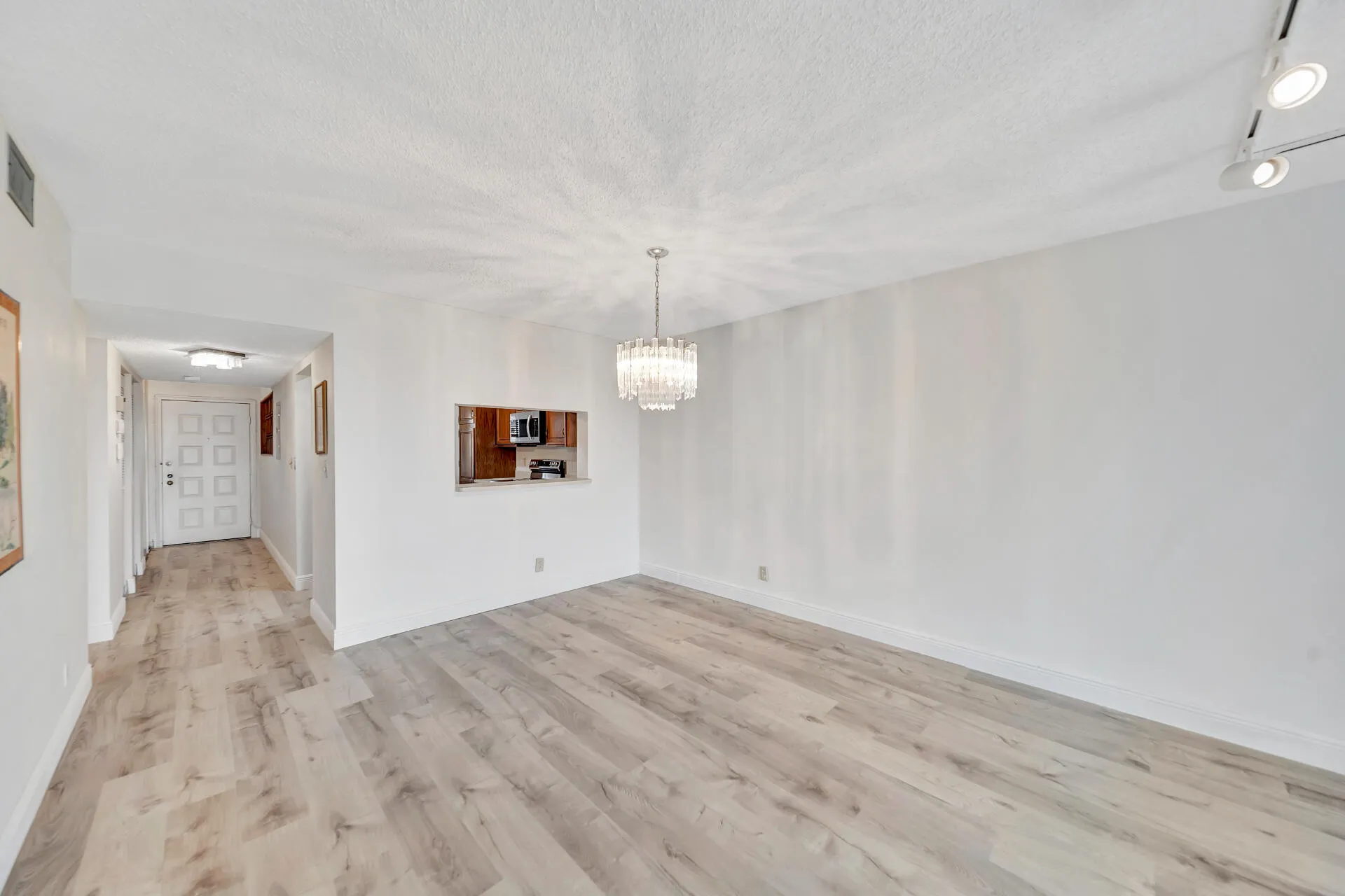 Dining Room; Kitchen Pass-Thru; and Unit Front Entrance