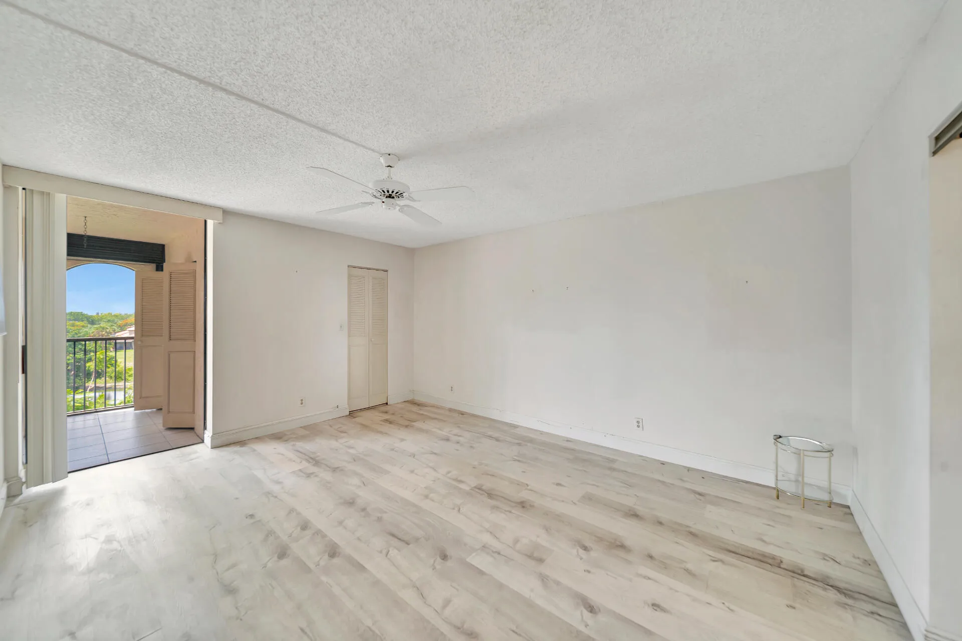 Primary Bedroom With Entry To Screened Balcony